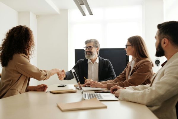 A group of professionals collaborating on HR tasks